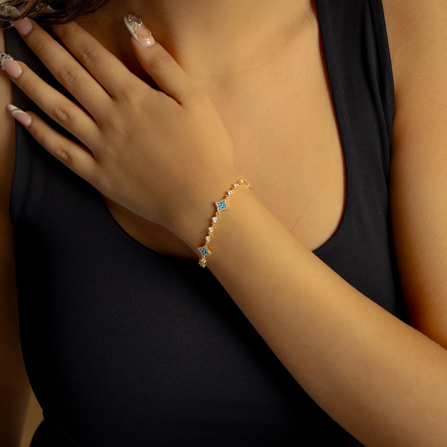 Gold Flower Tennis Bracelet - Blue Stones